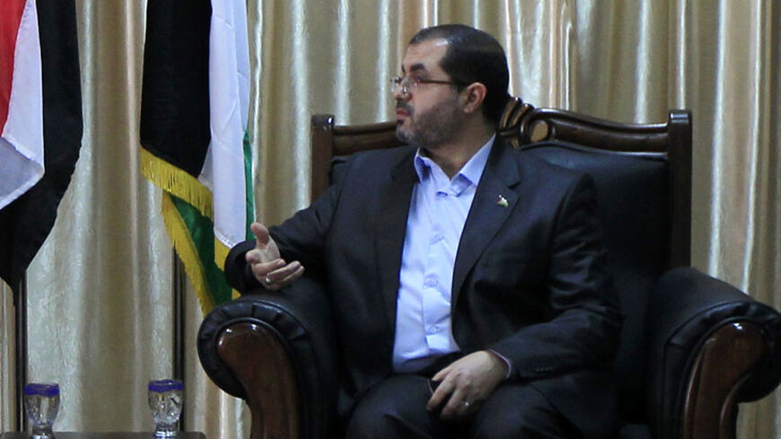 Egypt's Muslim Brotherhood party chief Saad al-Katatni (L) meets with Palestinian Hamas member Bassem Naim after his arrival through the Rafah border crossing in the southern Gaza Strip November 19, 2012. REUTERS/Said Khatib/Pool (GAZA - Tags: CIVIL UNREST POLITICS) - RTR3AM7C
