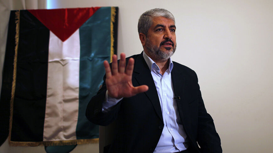 Hamas leader Khaled Meshaal talks during his interview with Reuters in Doha November 29, 2012. Meshaal said the de facto recognition of a sovereign Palestinian state won by his rival Mahmoud Abbas should be seen alongside Gaza's latest conflict with Israel as a single, bold strategy that could empower all Palestinians. Meshaal said the short war which claimed 162 Palestinian lives and five Israelis was concluded on terms set by the Palestinian Islamist movement and ended its isolation, creating a new mood t