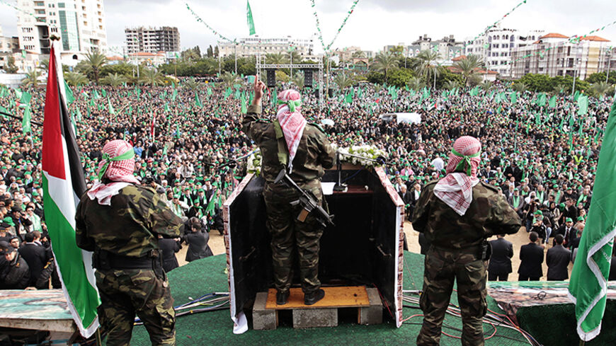 A Palestinian member of the Al-Qassam brigades, the armed wing of the Hamas movement, gives a speech during a rally marking the 25th anniversary of the founding of Hamas, in Gaza City December 8, 2012. Hamas leader Khaled Meshaal, in an uncompromising speech during his first ever visit to Gaza after decades of exile, told a mass rally on Saturday he would never recognise Israel and pledged to "free the land of Palestine inch by inch". REUTERS/Ahmed Jadallah (GAZA - Tags: POLITICS ANNIVERSARY CIVIL UNREST) -