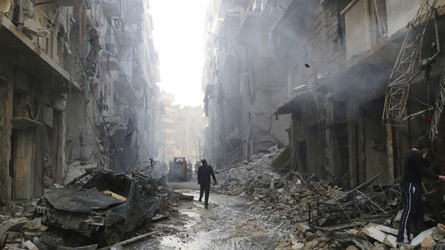 People inspect damage at a site hit by what activists said were barrel bombs dropped by forces loyal to Syria's President Bashar al-Assad in Aleppo's district of al-Sukari March 7, 2014.  REUTERS/Hosam Katan (SYRIA - Tags: CIVIL UNREST POLITICS TPX IMAGES OF THE DAY CONFLICT)         FOR BEST QUALITY IMAGES ALSO SEE: GF2EA42122E01 - RTR3G63Q