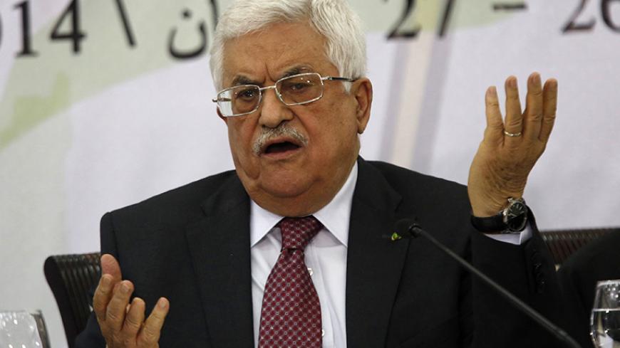 Palestinian President Mahmoud Abbas gestures as he address the Palestinian Liberation Organization's (PLO) central council in the West Bank City of Ramallah April 26, 2014. Abbas said on Saturday he was still ready to extend stalled peace talks with Israel, as long as it met his long-standing demands to free prisoners and halt building on occupied land. REUTERS/Mohamad Torokman (WEST BANK - Tags: POLITICS PROFILE) - RTR3MPL7