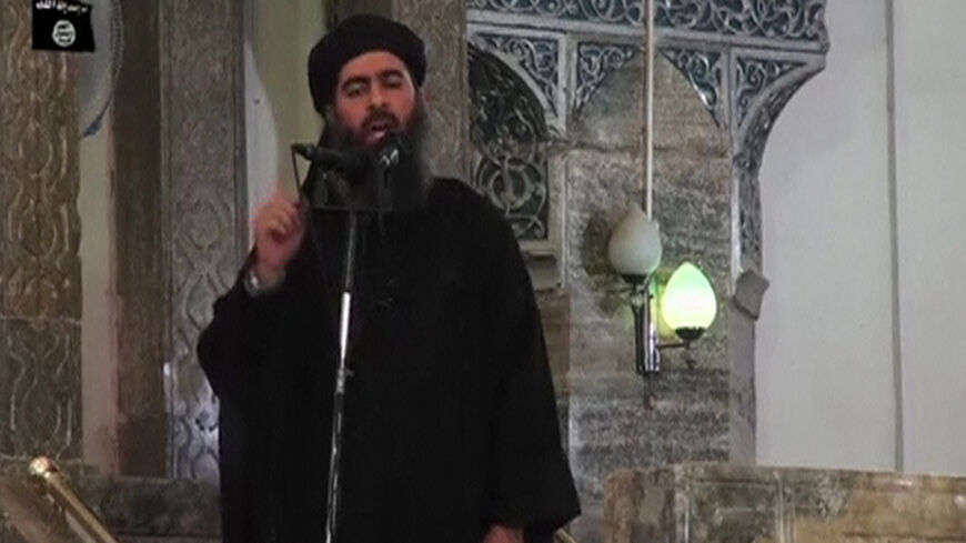 A man purported to be the reclusive leader of the militant Islamic State Abu Bakr al-Baghdadi has made what would be his first public appearance at a mosque in the centre of Iraq's second city, Mosul, according to a video recording posted on the Internet on July 5, 2014, in this still image taken from video. There had previously been reports on social media that Abu Bakr al-Baghdadi would make his first public appearance since his Islamic State in Iraq and the Levant (ISIL) changed its name to the Islamic S