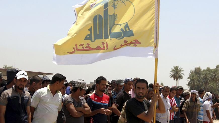 Shiite volunteers from Hezbollah Iraq, who have joined the Iraqi army to fight against militants of the Islamic State, formerly known as the Islamic State in Iraq and the Levant (ISIL), gather together in Baghdad, July 6, 2014. Iraqi Prime Minister Nuri al-Maliki's coalition should withdraw its support for his bid for a third term and pick another candidate, Shi'ite Muslim cleric Moqtada al-Sadr urged, amid parliamentary deadlock over the formation of a new government. Maliki has come under mounting pressur