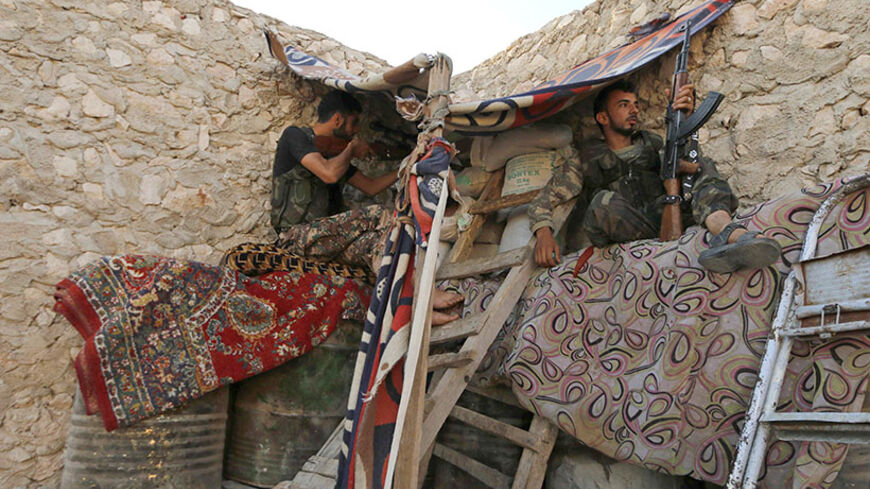 Free Syrian Army fighters sit in a shelter in Aleppo's Sheikh Najjar July 8, 2014. Picture taken July 8, 2014. 
REUTERS/Hosam Katan (SYRIA - Tags: POLITICS CIVIL UNREST CONFLICT) - RTR3XRRZ
