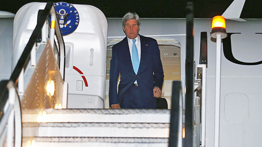 U.S. Secretary of State John Kerry disembarks from his aircraft after arriving at Kabul International Airport in Kabul, July 11, 2014. Kerry is expected to meet with Afghanistan's President Kharzai as well as both candidates in Afghanistan's recent presidential election.    REUTERS/Jim Bourg    (AFGHANISTAN - Tags: POLITICS) - RTR3Y34K
