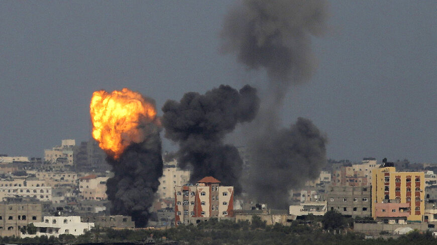 An explosion is seen in the northern Gaza Strip after an Israeli air strike July 13, 2014. Israeli naval commandos clashed with Hamas militants in a raid on the coast of the Gaza Strip on Sunday, in what appeared to be the first ground assault of a six-day Israeli offensive on the territory aimed at stopping Palestinian rocket fire. REUTERS/Ammar Awad (GAZA - Tags: POLITICS CIVIL UNREST) - RTR3YCA0