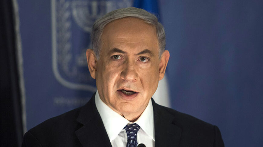 Israel's Prime Minister Benjamin Netanyahu speaks during a joint news conference with Germany's Foreign Minister Frank-Walter Steinmeier (not pictured) in Tel Aviv July 15, 2014. Israel sees in the Egyptian-proposed Gaza truce an opportunity to strip the Palestinian enclave of rockets but is prepared to redouble military action there if the cross-border launches persist, Netanyahu said on Tuesday. REUTERS/Dan Balilty/Pool (ISRAEL - Tags: POLITICS CIVIL UNREST) - RTR3YPXL