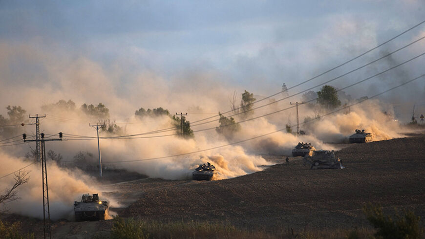 Israeli tanks manoeuvre outside the northern Gaza Strip July 18, 2014. Israel intensified its land offensive in Gaza with artillery, tanks and gunboats on Friday and warned it could "significantly widen" an operation Palestinian officials said was killing ever greater numbers of civilians. The Israeli land advance followed 10 days of barrages against Gaza from air and sea, hundreds of rockets fired by Hamas into Israel and failed attempts by Egypt, a broker of ceasefires in previous Israeli-Palestinian flar