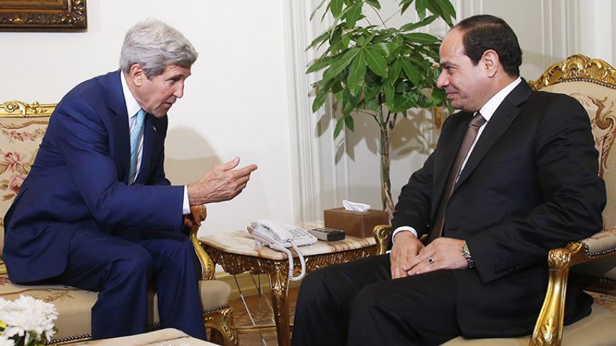 U.S. Secretary of State John Kerry (L) speaks with Egyptian President Abdel Fattah al-Sisi in Cairo July 22, 2014. Israel pounded targets across the Gaza Strip on Tuesday, saying no ceasefire was near as top U.S. and U.N. diplomats pursued talks on halting fighting that has claimed more than 500 lives. Dispatched by U.S. President Barack Obama to the Middle East to seek a ceasefire, Kerry held talks on Tuesday in Cairo with Egyptian Foreign Minister Sameh Shukri.  REUTERS/Charles Dharapak/Pool (EGYPT - Tags