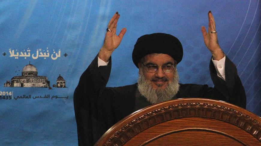 Lebanon's Hezbollah leader Sayyed Hassan Nasrallah gestures as he makes a rare public appearance to addresses his supporters during a rally to mark "Quds (Jerusalem) Day" in Beirut's southern suburbs July 25, 2014. REUTERS/Sharif Karim (LEBANON - Tags: POLITICS CIVIL UNREST ANNIVERSARY) - RTR404VX