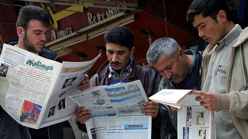 Iraqi Kurds read newspapers at a newspaper stand in Arbil, northern
Iraq, Febuary 19, 2003. Iraqi Kurds in the breakaway enclave of
northern Iraq said they had arrested Iraqi agents threatening the
safety of opposition leaders gathering to plan for the future of Iraq
if the United States topples Saddam Hussein. REUTERS/Caren Firouz

CJF - RTRIL1S