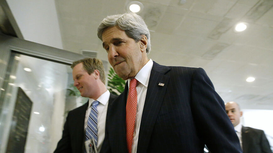 U.S. Secretary of State John Kerry arrives to brief members of the U.S. Senate on talks with Iran during a closed-door meeting at the Capitol in Washington, December 11, 2013. REUTERS/Jonathan Ernst    (UNITED STATES - Tags: POLITICS MILITARY) - RTX16EEK