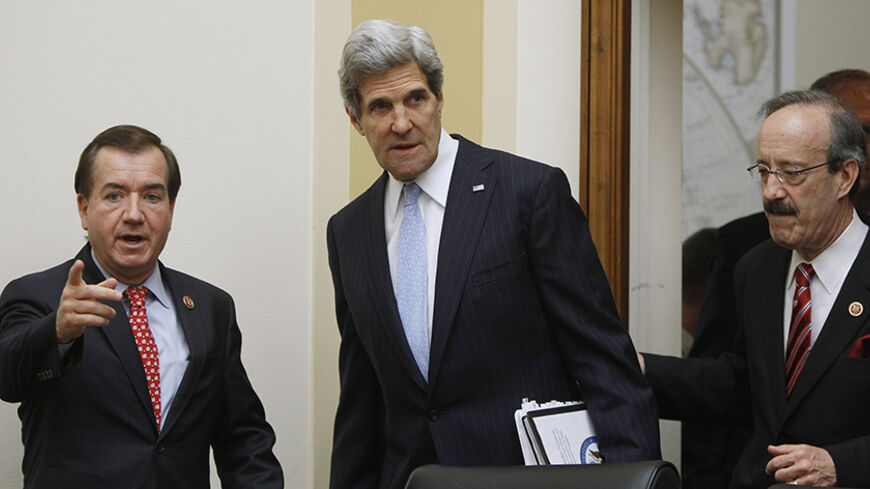 U.S. Secretary of State John Kerry (C) is escorted by Rep. Ed Royce (R-CA) (L), chairman of the House Foreign Affairs Committee, and Rep. Eliot Engel (D-NY) (R) before giving testimony on Capitol Hill in Washington April 17, 2013. REUTERS/Gary Cameron (UNITED STATES - Tags: POLITICS) - RTXYPB6