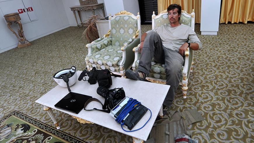 A photo taken on September 29, 2011 shows US freelance reporter James Foley resting in a room at the airport of Sirte, Libya. Foley was kidnapped in war-torn Syria six weeks ago and has been missing since, his family revealed on January 2, 2013. Foley, 39, an experienced war reporter who has covered other conflicts, was seized by armed men in the town of Taftanaz in the northern province of Idlib on November 22, according to witnesses. The reporter contributed videos to Agence France-Presse (AFP) in recent 