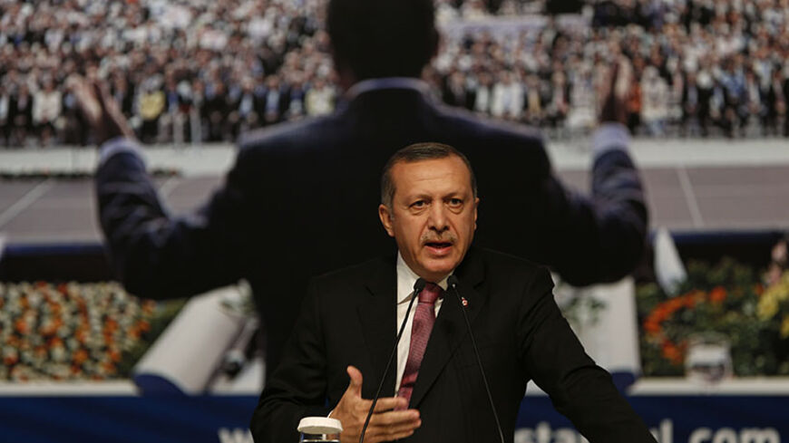 Turkey's Prime Minister and leader of Justice and Development Party (AKP) Tayyip Erdogan makes a speech during a party meeting in Istanbul September 22, 2012. The party's September 30, 2012 congress is unlikely to offer any sign Erdogan, viewed by many Turks as their strongest leader since Ataturk, is loosening his grip on a heavily-centralised party or on the country as a whole.  Picture taken September 22, 2012. To match story TURKEY-AKP/  REUTERS/Murad Sezer (TURKEY - Tags: POLITICS) - RTR38FHK