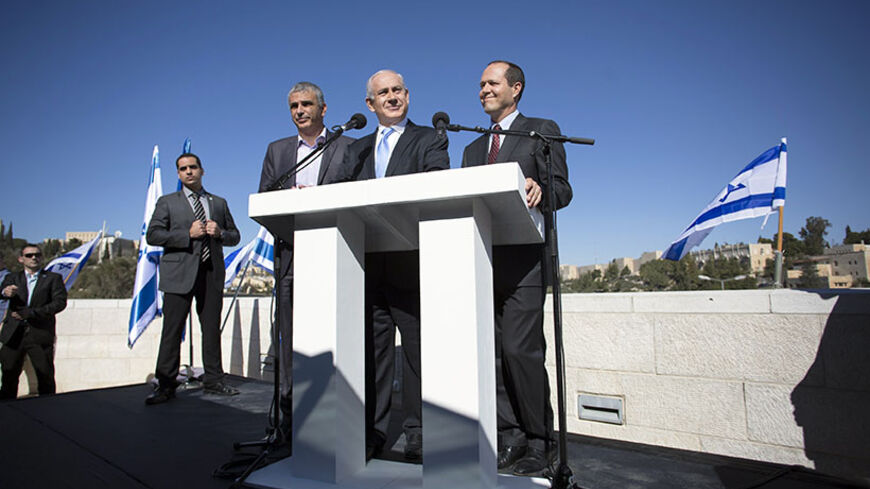 Israel's Prime Minister Benjamin Netanyahu (C) stands with Jerusalem Mayor Nir Barkat (R) and Communications Minister Moshe Kahlon outside the Menachem Begin Heritage Center in Jerusalem January 21, 2013. Netanyahu made an election eve appeal to wavering supporters to "come home", showing concern over a forecast far-right surge that would keep him in power but weaken him politically. REUTERS/Baz Ratner (JERUSALEM - Tags: POLITICS ELECTIONS) - RTR3CQJU