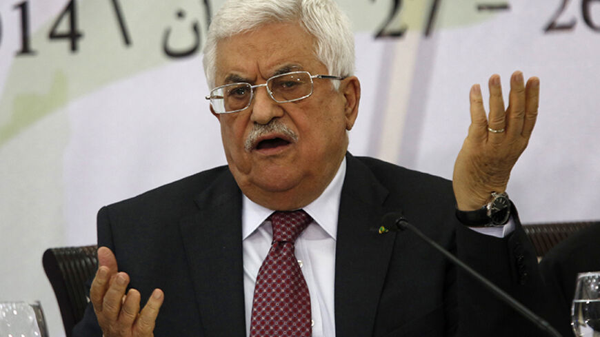 Palestinian President Mahmoud Abbas gestures as he address the Palestinian Liberation Organization's (PLO) central council in the West Bank City of Ramallah April 26, 2014. Abbas said on Saturday he was still ready to extend stalled peace talks with Israel, as long as it met his long-standing demands to free prisoners and halt building on occupied land. REUTERS/Mohamad Torokman (WEST BANK - Tags: POLITICS PROFILE) - RTR3MPL7