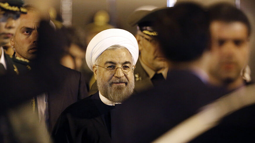 Iran's President Hassan Rouhani arrives at Pudong International Airport, ahead of the fourth Conference on Interaction and Confidence Building Measures in Asia (CICA) summit in Shanghai May 20, 2014.  REUTERS/Carlos Barria (CHINA - Tags: POLITICS) - RTR3Q000