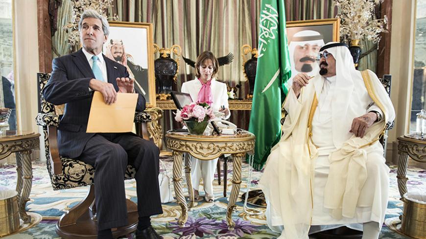 Saudi King Abdullah bin Abdulaziz al-Saud (R) and U.S. Secretary of State John Kerry wait for a meeting at the King's private residence in the Red Sea city of Jeddah June 27, 2014. Kerry arrived in Jeddah on Friday to discuss the crises in Iraq and Syria with Saudi Arabia's King Abdullah and meet Syrian opposition leader Ahmad Jarba, who has close ties to the kingdom. REUTERS/Brendan Smialowski/Pool (SAUDI ARABIA - Tags: POLITICS CIVIL UNREST) - RTR3W2PT