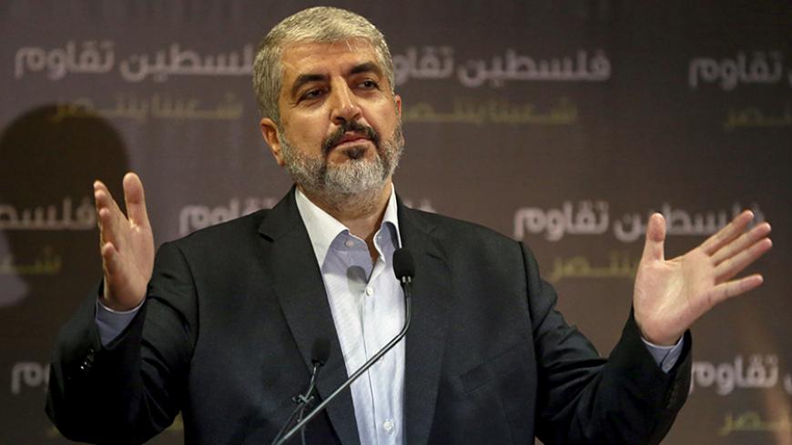 Hamas leader Khaled Meshaal talks during a news conference in Doha July 23, 2014. Meshaal said he was ready to accept a humanitarian truce in Gaza where the Islamist group is fighting an Israeli military offensive, but would not agree to a full ceasefire until the terms had been negotiated. REUTERS/Stringer (QATAR - Tags: POLITICS CIVIL UNREST CONFLICT MILITARY) - RTR3ZVT6