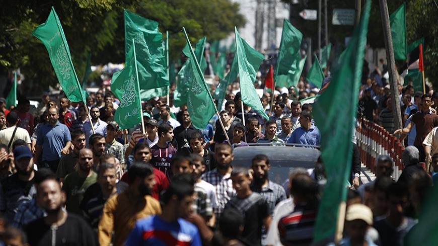 A crowd gathers during a rally in support of Hamas, in Gaza City August 7, 2014. Mediators worked against the clock on Thursday to extend a Gaza truce between Israel and the Palestinians as the three-day ceasefire went into its final 24 hours. Israel has said it is ready to agree to an extension as Egyptian mediators pursued talks with Israelis and Palestinians on an enduring end to a war that devastated the Hamas-ruled enclave, while Palestinians want an Israeli-Egyptian blockade of Gaza to be lifted and p