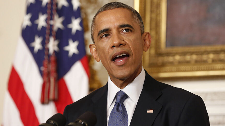 U.S. President Barack Obama talks about the humanitarian relief situation in Iraq, at the State Dining Room of the White House in Washington August 7, 2014.        REUTERS/Larry Downing   (UNITED STATES - Tags: POLITICS) - RTR41N39