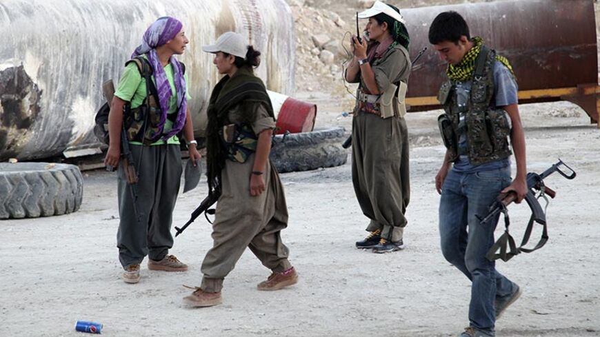 Kurdistan Workers Party (PKK) fighters participate in an intensive security deployment against Islamic State (IS) militants on the front line in Makhmur August 9, 2014. President Barack Obama said on Saturday U.S. airstrikes had destroyed arms that Islamic State militants could have used against Iraqi Kurds, but warned there was no quick fix to a crisis that threatens to tear Iraq apart. Speaking the day after U.S. warplanes hit militants in Iraq, Obama said it would take more than bombs to restore stabilit