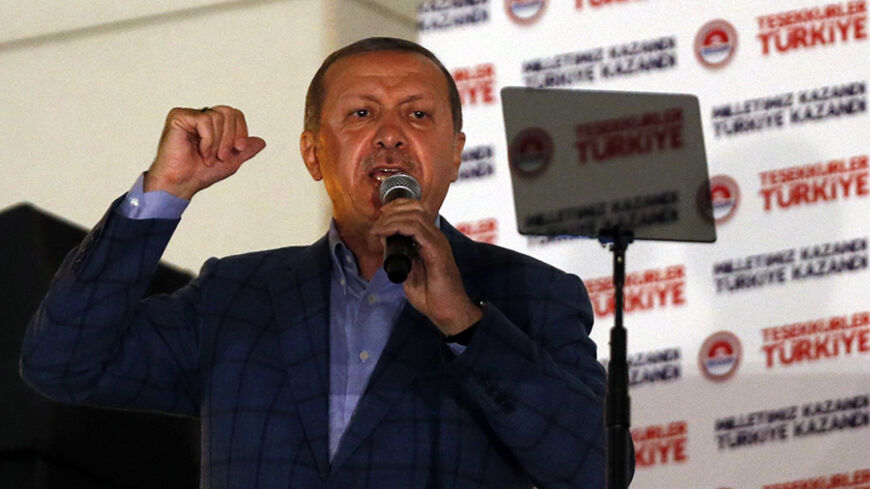Turkey's Prime Minister Tayyip Erdogan gestures as he addresses to supporters during the celebrations of his election victory in front of the party headquarters in Ankara August 10, 2014. Erdogan secured his place in history as Turkey's first directly elected president on Sunday, sweeping more than half the vote in a result his opponents fear heralds an increasingly authoritarian state. REUTERS/Umit Bektas (TURKEY  - Tags: POLITICS ELECTIONS)   - RTR41W94