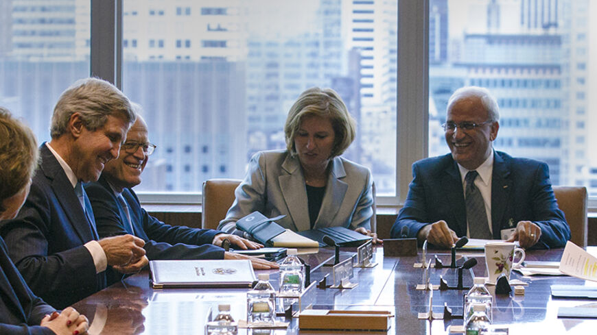 U.S. Secretary of State John Kerry (L), Israeli Foreign Minister Tzipi Livni (C) and Palestinian representative Saeb Erekat sit before a meeting of the Middle East Quartet on the sidelines of the U.N. General Assembly at the U.N. headquarters in New York September 27, 2013. REUTERS/Brendan McDermid (UNITED STATES - Tags: POLITICS) - RTX142KR
