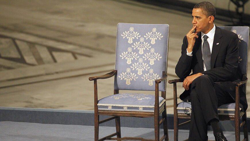 Nobel Peace Prize laureate U.S. President Barack Obama listens to a performance during the Nobel Peace Prize award ceremony at Oslo City Hall December 10, 2009. The Nobel committee is awarding the peace prize to Obama for "his extraordinary efforts to strengthen international diplomacy and cooperation between peoples" and cited his push for nuclear disarmament.  REUTERS/Thomas Peter (NORWAY) - RTXRP1N