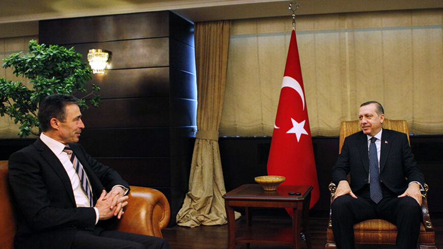 NATO Secretary General Anders Fogh Rasmussen (L) attends a meeting with Turkey's Prime Minister Recep Tayyip Erdogan in Ankara April 4, 2011. REUTERS/Umit Bektas (TURKEY - Tags: POLITICS) - RTR2KSUV
