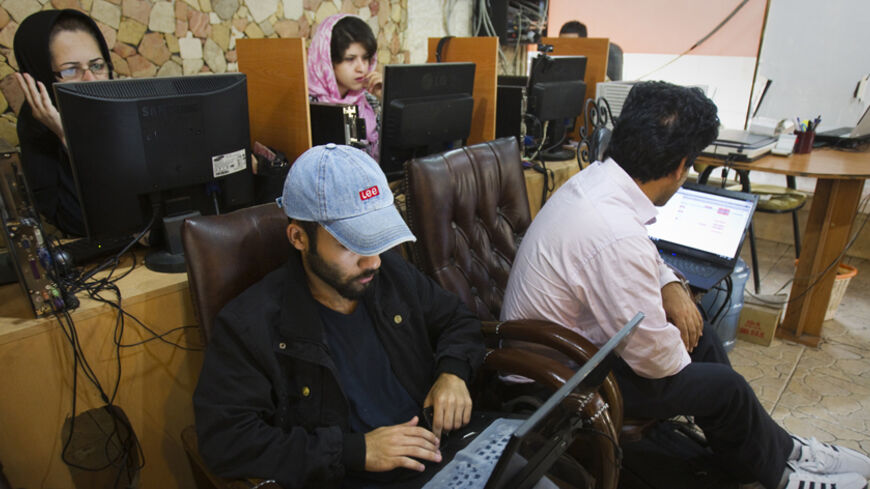 Customers use computers at an internet cafe in Tehran May 9, 2011. Websites like Facebook, Twitter, YouTube and countless others were banned shortly after the re-election of Iran's President Mahmoud Ahmadinejad and the huge street protests that followed. Seen by the government as part of a "soft war" waged by the enemies of the Islamic Republic, social networking and picture sharing sites were a vital communication tool for the anti-Ahmadinejad opposition -- more than a year before they played a similar rol