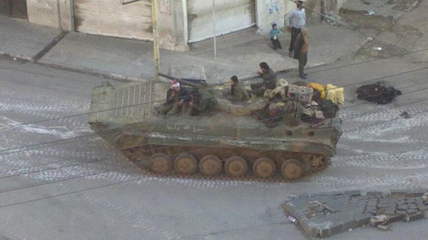 A Syrian army tank is seen in the neighbourhood of Zabadani, near Damascus, in this handout received February 17, 2012. Picture received February 17, 2012.      REUTERS/Handout (SYRIA - Tags: CIVIL UNREST MILITARY POLITICS) FOR EDITORIAL USE ONLY. NOT FOR SALE FOR MARKETING OR ADVERTISING CAMPAIGNS. THIS IMAGE HAS BEEN SUPPLIED BY A THIRD PARTY. IT IS DISTRIBUTED, EXACTLY AS RECEIVED BY REUTERS, AS A SERVICE TO CLIENTS - RTR2Y0W2