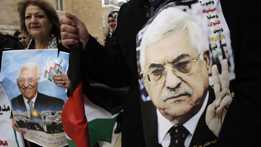 Palestinians hold posters depicting President Mahmoud Abbas during a rally in the West Bank town of Bethlehem March 17, 2014. Thousands of Palestinians took to the streets on Monday to show their support for Abbas, who is under heavy pressure as he prepares to meet U.S. President Barack Obama. REUTERS/Ammar Awad (WEST BANK - Tags: POLITICS CIVIL UNREST RELIGION) - RTR3HFCL