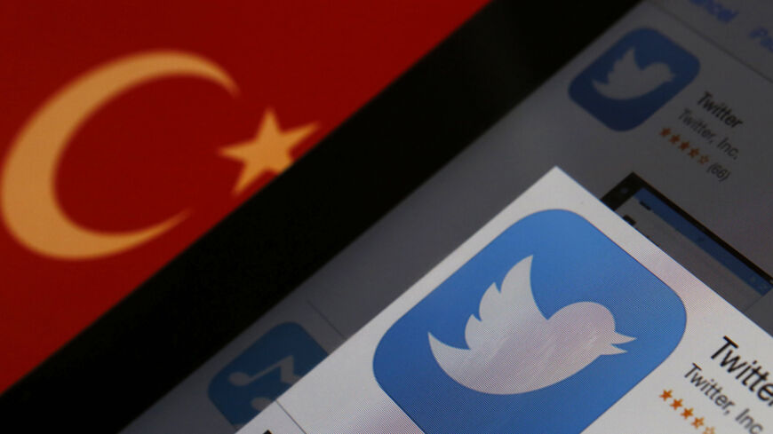 A Twitter logo on an iPad display is pictured next to a Turkish flag in this photo illustration taken in Istanbul March 21, 2014. Turkey's courts have blocked access to Twitter a little over a week before elections as Prime Minister Tayyip Erdogan battles a corruption scandal that has seen social media awash with alleged evidence of government wrongdoing. The ban came hours after a defiant Erdogan, on the campaign trail ahead of key March 30 local elections, vowed to "wipe out" Twitter and said he did not c