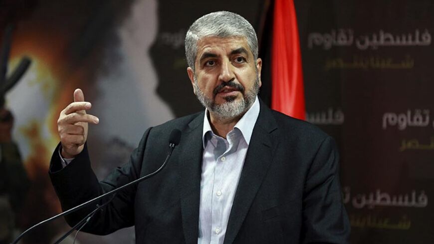 Hamas leader Khaled Meshaal talks during a news conference in Doha July 23, 2014. Meshaal said he was ready to accept a humanitarian truce in Gaza where the Islamist group is fighting an Israeli military offensive, but would not agree to a full ceasefire until the terms had been negotiated. REUTERS/Stringer (QATAR - Tags: POLITICS CIVIL UNREST CONFLICT) - RTR3ZVSR