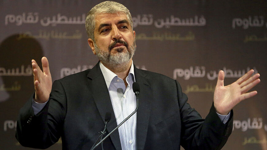 Hamas leader Khaled Meshaal talks during a news conference in Doha July 23, 2014. Meshaal said he was ready to accept a humanitarian truce in Gaza where the Islamist group is fighting an Israeli military offensive, but would not agree to a full ceasefire until the terms had been negotiated. REUTERS/Stringer (QATAR - Tags: POLITICS CIVIL UNREST CONFLICT MILITARY) - RTR3ZVT6