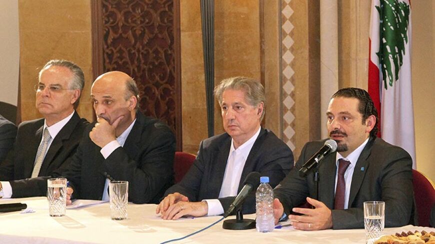 Former prime minister Saad al-Hariri (R) speaks during a meeting with the members of the "14 March Alliance" as former President Amin Gemayel (2nd R) and Samir Geagea (2nd L), leader of the Christian Lebanese Forces listen in Beirut August 8, 2014. Al-Hariri returned to Lebanon on Friday for the first time in three years, on a visit seen as reasserting a moderate influence over the Sunni community following a deadly incursion by Islamist militants. REUTERS/Dalati Nohra/Handout via Reuters (LEBANON - Tags: P