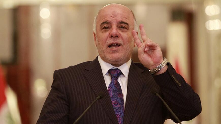 Iraq's Prime Minister-designate Haider al-Abadi speaks during a press conference in Baghdad August 25, 2014. Abadi on Monday predicted a "clear vision" on a new government would emerge within the next two days, state television reported, as the country faces deepening sectarian conflict.  REUTERS/Mahmoud Raouf Mahmoud (IRAQ - Tags: CIVIL UNREST POLITICS) - RTR43O7D