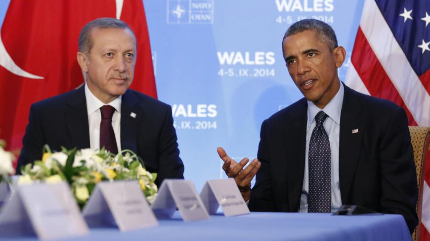 U.S. President Barack Obama speaks as he hosts a bilateral meeting with Turkey's President Tayyip Erdogan during the NATO Summit at the Celtic Manor Resort in Newport, Wales September 5, 2014.      REUTERS/Larry Downing   (UNITED KINGDOM - Tags: POLITICS) - RTR453HP