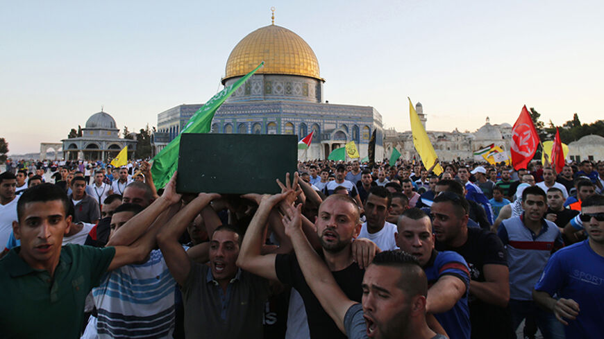 Palestinians carry the coffin of Mohammed Sinokrot during his funeral in front of the Dome of the Rock, on the compound known to Muslims as Noble Sanctuary and to Jews as Temple Mount, in Jerusalem's Old City September 8, 2014. Scores of Palestinians rioted in the East Jerusalem neighbourhood of Wadi al-Joz for a second day after hearing that the youth from their neighbourhood had died of wounds suffered in a clash with Israeli police last week. Sinokrot succumbed to a head wound suffered during a protest a