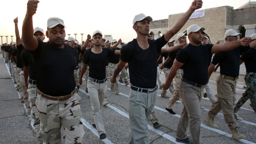 Volunteers who joined the Iraqi army to fight against Islamic State (IS) militants march during training in Basra, southeast of Baghdad, September 9, 2014. Picture taken September 9, 2014. REUTERS/Essam Al-Sudani (IRAQ - Tags - CIVIL UNREST MILITARY POLITICS CONFLICT) - RTR45NPC