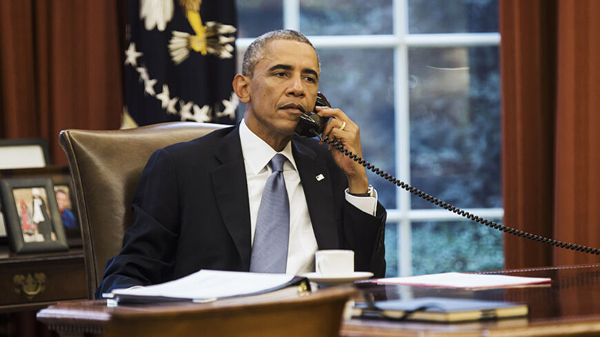 U.S. President Barack Obama speaks on the phone with Saudi Arabia's King Abdullah from the Oval Office of the White House in Washington September 10, 2014. President Barack Obama called Saudi Arabia's King Abdullah on Wednesday ahead of an evening speech in which the U.S. leader plans to lay out his strategy for defeating the militant group Islamic State, the White House said. REUTERS/Kevin Lamarque  (UNITED STATES - Tags: POLITICS CIVIL UNREST CONFLICT TPX IMAGES OF THE DAY) - RTR45PEQ