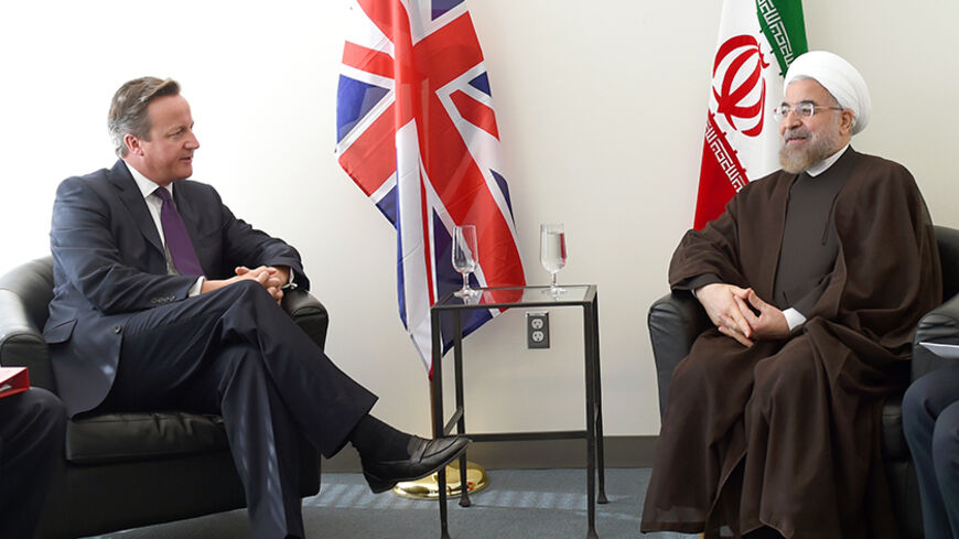 Britain's Prime Minister David Cameron (L) meets with Iran's President Hassan Rouhani during the 69th United Nations General Assembly in New York September 24, 2014. REUTERS/Timothy A. Clary/Pool (UNITED STATES - Tags: POLITICS) - RTR47JEP