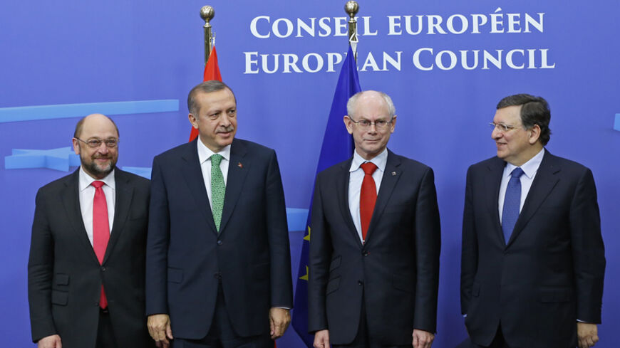 Turkey's Prime Minister Recep Tayyip Erdogan (2nd L) poses for a family photo with European Parliament President Martin Schulz (L), European Union Council President Herman Van Rompuy (2nd R) and European Commission President Jose Manuel Barroso (R) ahead of a EU-Turkey summit at the EU council headquarters in Brussels January 21, 2014. REUTERS/Yves Herman (BELGIUM - Tags: POLITICS) - RTX17NZX