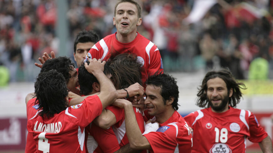 Iran's Persepolis players celebrate their goal against UAE?s Al-Sharjah during their AFC Champions League soccer match at Tehran's Azadi stadium, March 10, 2009. REUTERS/Morteza Nikoubazl (IRAN SPORT SOCCER) - RTXCKYC