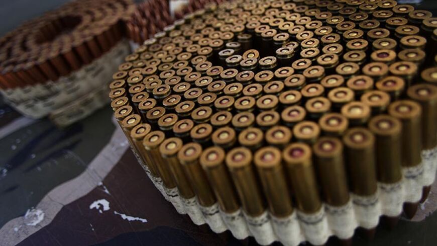 Bullets are displayed on a table during the Big Sandy Shoot in Mohave County, Arizona March 22, 2013. The Big Sandy Shoot is the largest organized machine gun shoot in the United States attended by shooters from around the country. Vintage and replica style machine guns and cannons are some of the weapons displayed during the event. Picture taken March 22, 2013. REUTERS/Joshua Lott (UNITED STATES - Tags: SOCIETY) - RTXXWYG