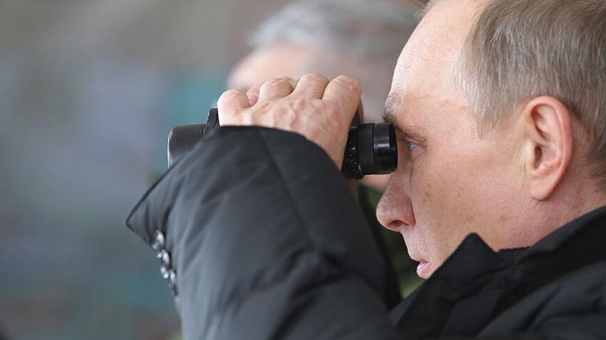 Russia's President Vladimir Putin oversees large-scale military exercises at the Raevsky training ground in Krasnodar Region March 29, 2013. Putin ordered large-scale military exercises in the Black Sea on Thursday, projecting Russian power towards Europe and the Middle East in a move that may vex neighbours.  REUTERS/Mikhail Klimentyev/RIA Novosti/Pool (RUSSIA - Tags: POLITICS MILITARY) THIS IMAGE HAS BEEN SUPPLIED BY A THIRD PARTY. IT IS DISTRIBUTED, EXACTLY AS RECEIVED BY REUTERS, AS A SERVICE TO CLIENTS