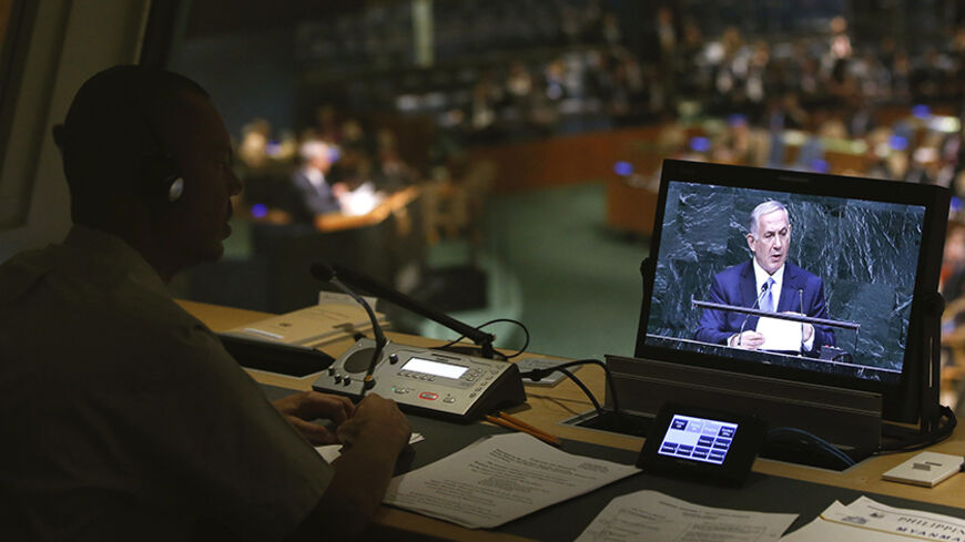 Israel's Prime Minister Benjamin Netanyahu is seen on a video display monitor inside an interpreters booth as he addresses the 69th United Nations General Assembly at the U.N. headquarters in New York September 29, 2014.
REUTERS/Shannon Stapleton (UNITED STATES - Tags: POLITICS) - RTR4881P
