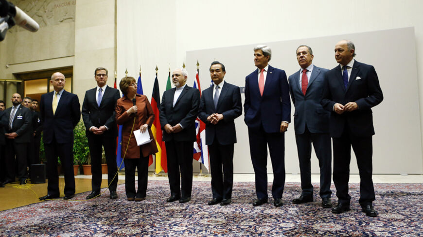 European Union foreign policy chief Catherine Ashton (3rd L) delivers a statement during a ceremony next to British Foreign Secretary William Hague, Germany's Foreign Minister Guido Westerwelle, Iranian Foreign Minister Mohammad Javad Zarif, Chinese Foreign Minister Wang Yi, U.S. Secretary of State John Kerry, Russia's Foreign Minister Sergei Lavrov and French Foreign Minister Laurent Fabius (L-R) at the United Nations in Geneva November 24, 2013. Iran and six world powers reached a breakthrough agreement e